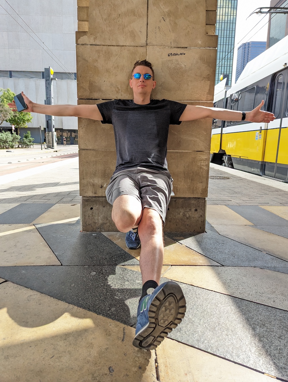 Showing off arm span next to the DART train.